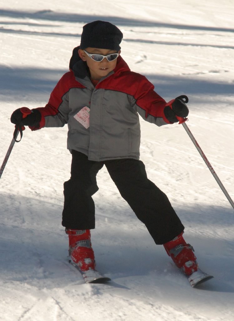 Freedom of Skiing. Kid skiing image.